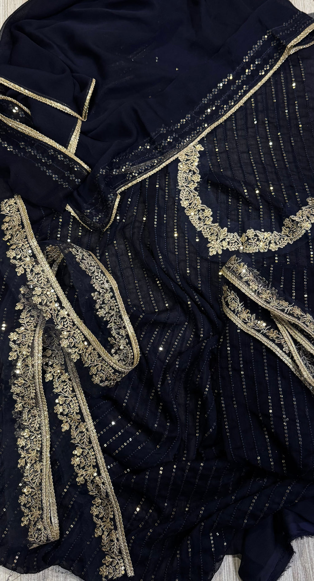 Elegant three-piece suit featuring intricate sequence embroidery throughout 322
