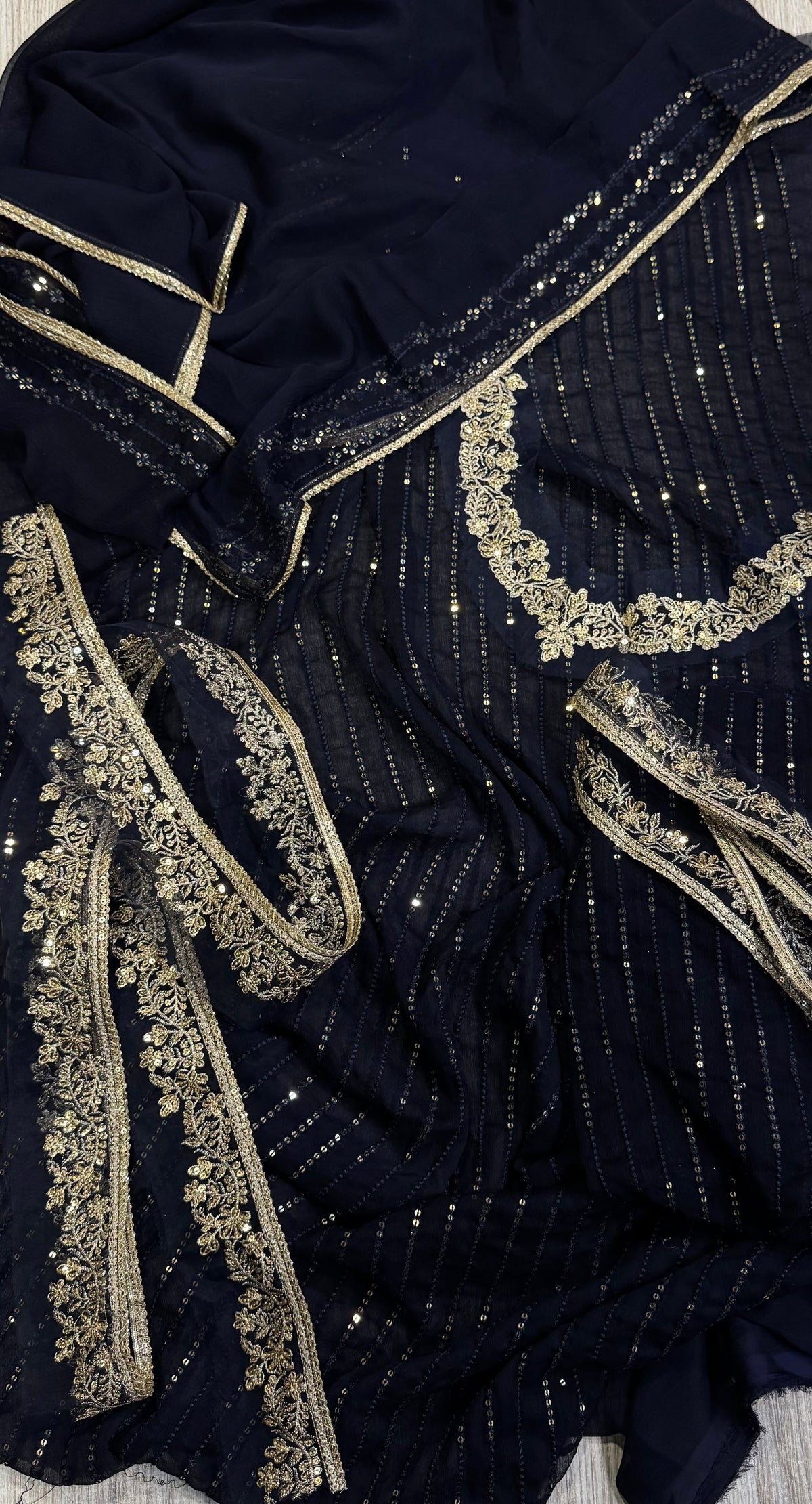 Elegant three-piece suit featuring intricate sequence embroidery throughout 322
