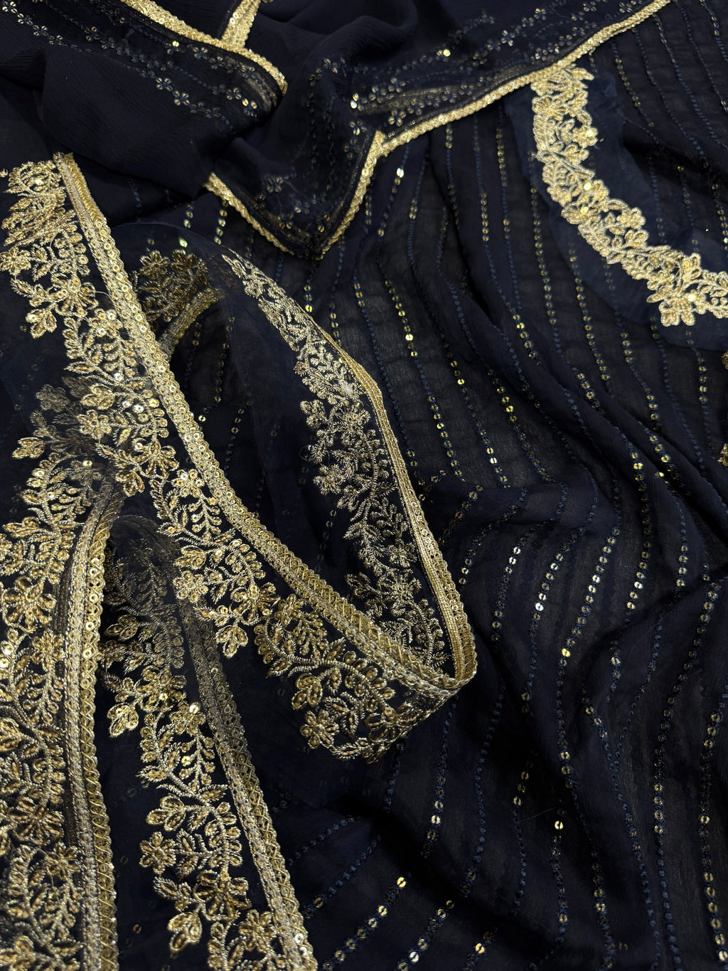 Elegant three-piece suit featuring intricate sequence embroidery throughout 322