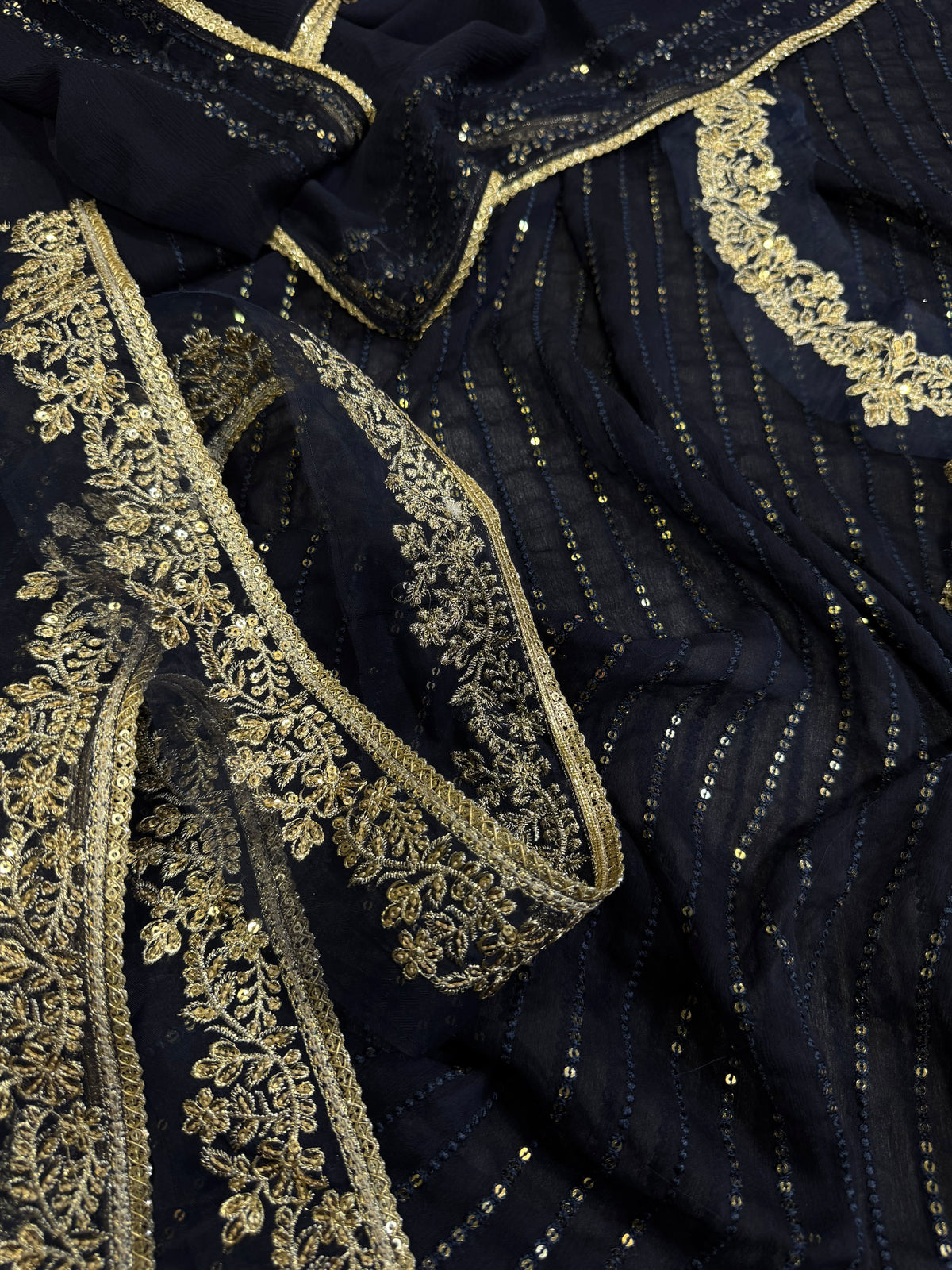 Elegant three-piece suit featuring intricate sequence embroidery throughout 322