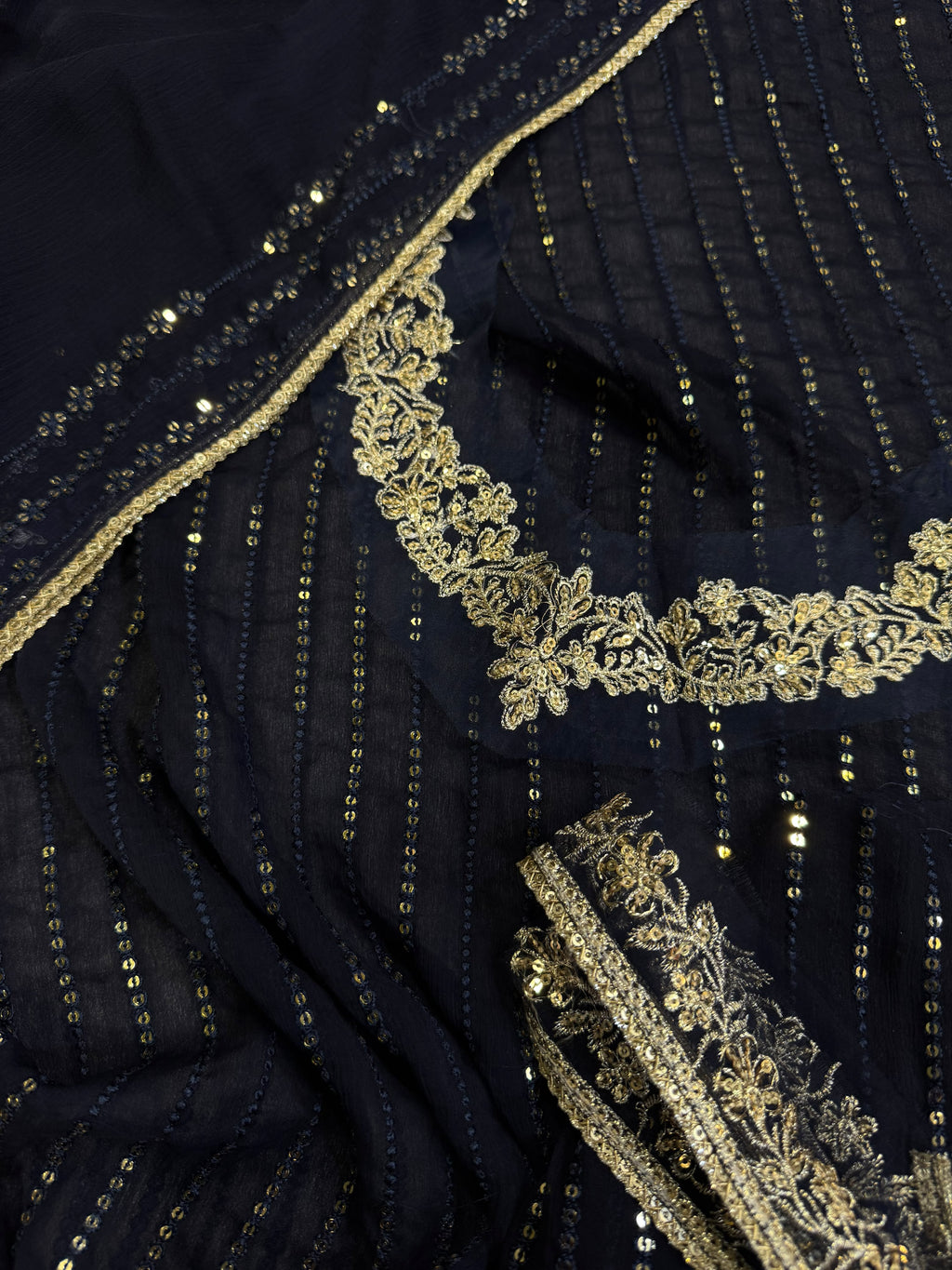 Elegant three-piece suit featuring intricate sequence embroidery throughout 322