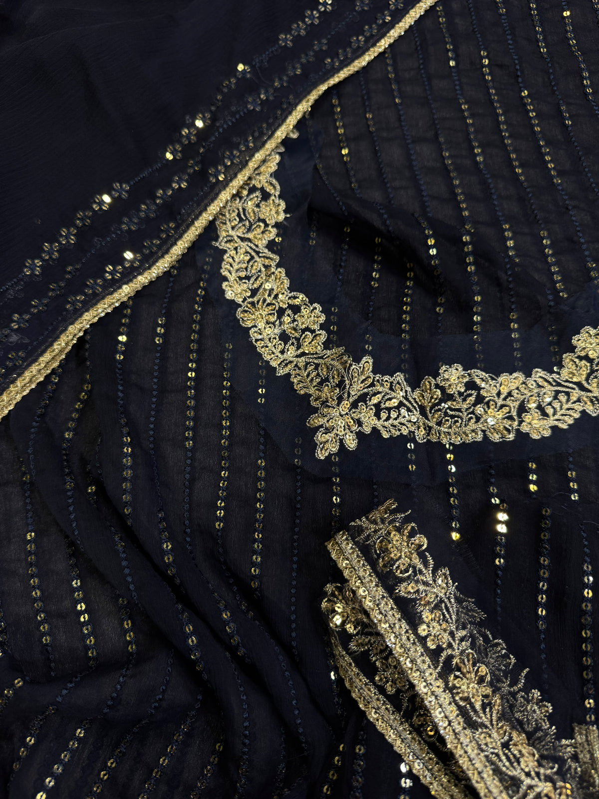 Elegant three-piece suit featuring intricate sequence embroidery throughout 322