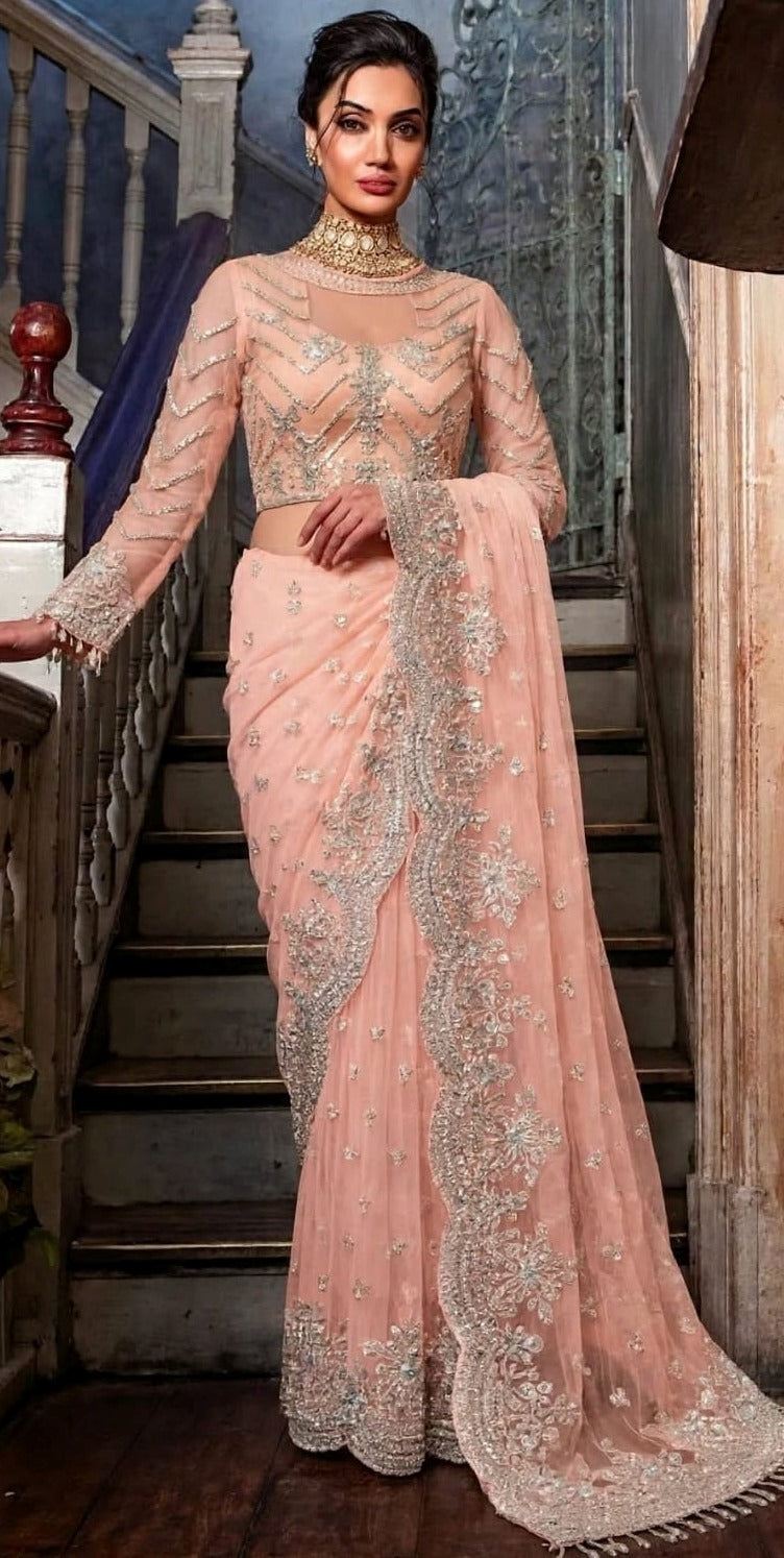 Exquisite net saree adorned with intricate embroidery featuring sequins, stones 5034