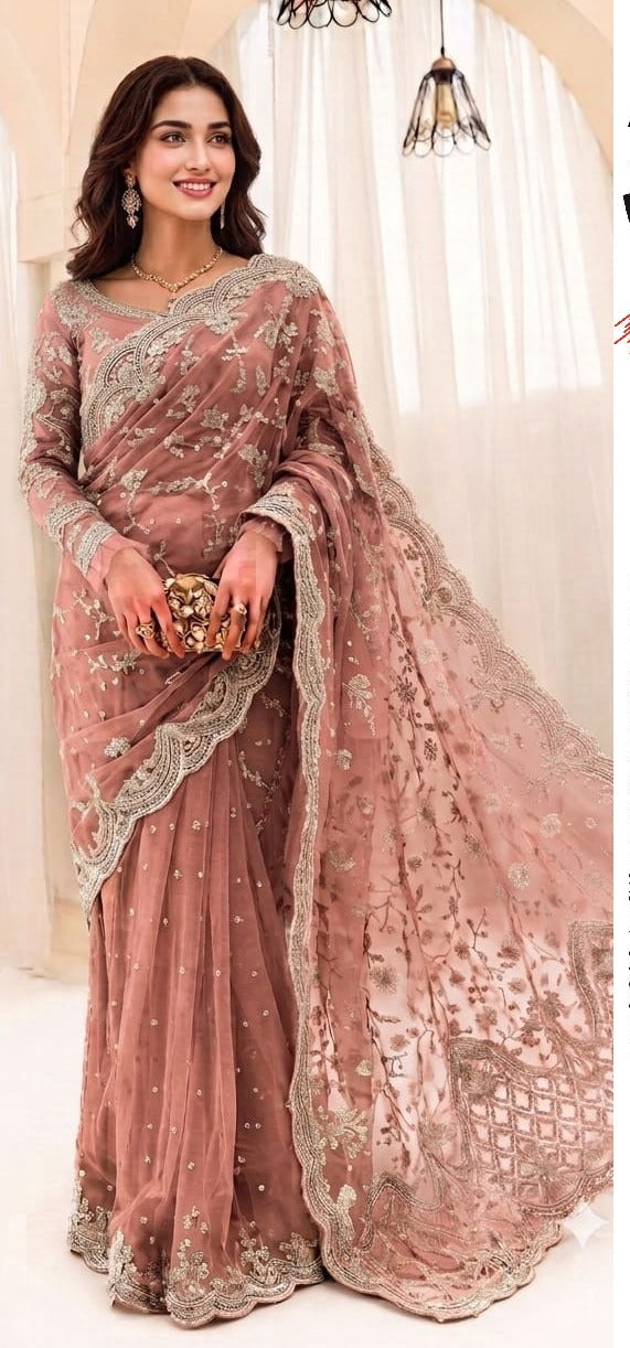 Exquisite net saree adorned with intricate embroidery featuring sequins, stones, and pearls throughout