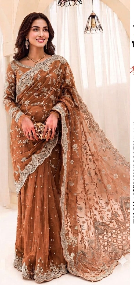 Exquisite net saree adorned with intricate embroidery featuring sequins, stones, and pearls throughout