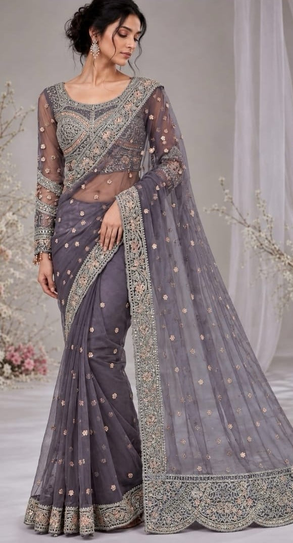 Elegant net saree crafted with intricate embroidery featuring sequins, stones 5038