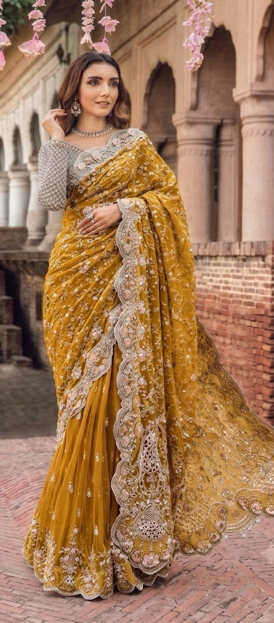 Elegant net saree featuring exquisite embroidery with sequins, stones